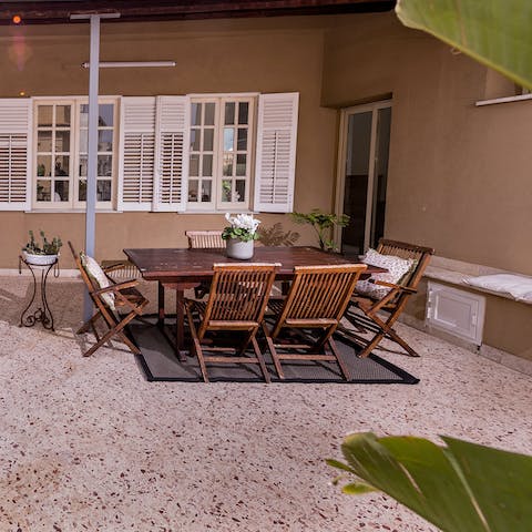 Enjoy some parmigiana di melanzane at your dining table on the second terrace