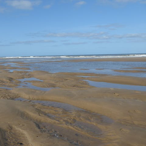 Start your day with a gentle stroll along Mundesley Beach, a stone's throw from home