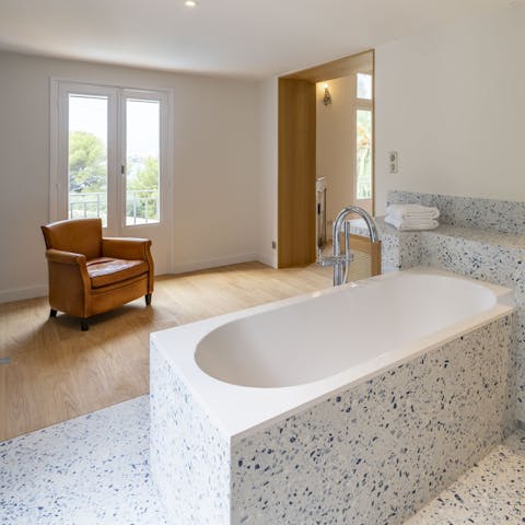 Unwind with a soak in the deep bath tub