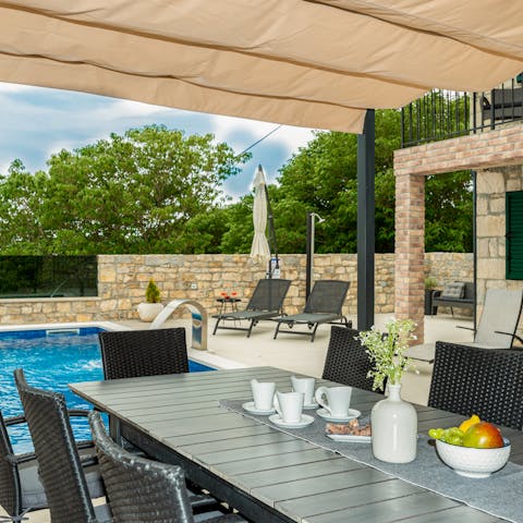 Dine alfresco with loved ones on the covered terrace