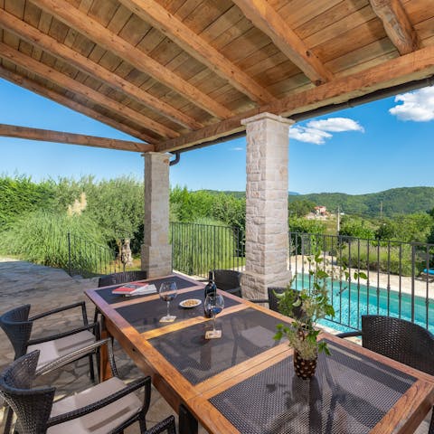 Dine alfresco as the sun sets over the countryside
