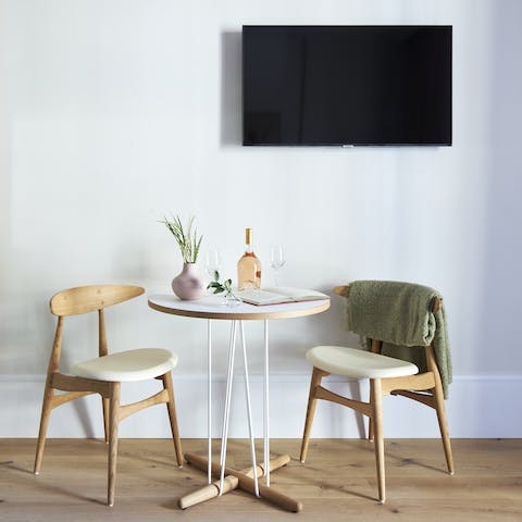 Enjoy a drink at the home's cute dining table