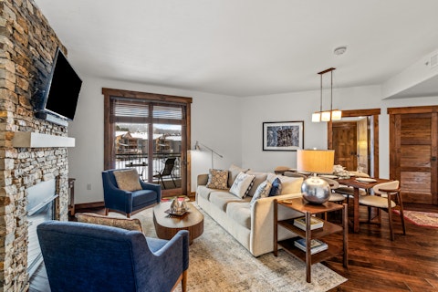 Gather round the stone fireplace after a day on the slopes