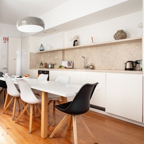 Fix yourself a coffee in the sleek marble kitchen