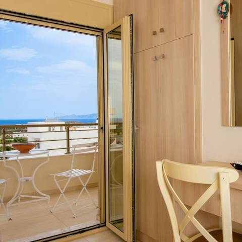Wake up to coastal views from the bedroom’s balcony