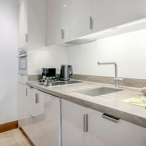 Whip up tasty meals in the well-equipped, open-plan kitchen