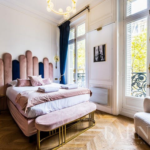 Wake to sunlight streaming in through the traditional Parisian windows