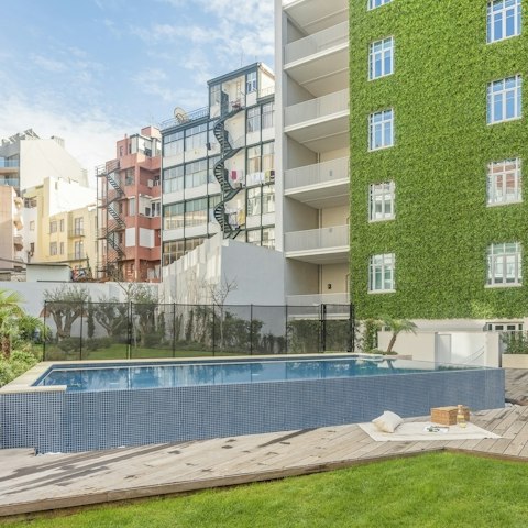 Head to the building's shared pool for a cooling dip
