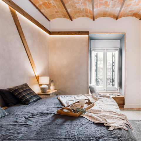 Curl up with a travel book in the bedroom's window seat