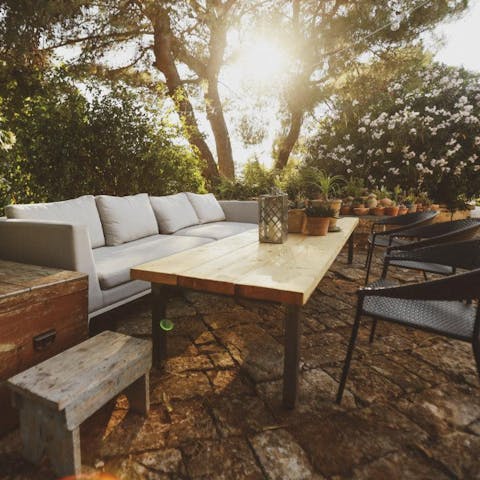 Sip cocktails on the patio in soft, dappled sunlight