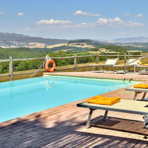 Take in the view of the Tuscan hills from a lounger or the cool of the swimming pool