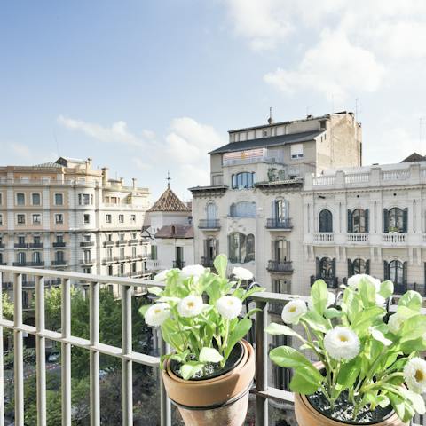 Perch by one of the Juliet balconies with a glass of Spanish wine while indulging in some people-watching