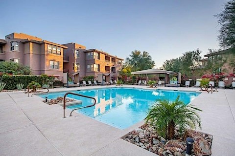 Drift into the pool as the desert evening sets in