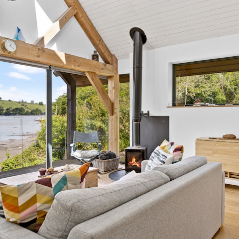 Cosy up by the fire and watch the sun set over the harbour