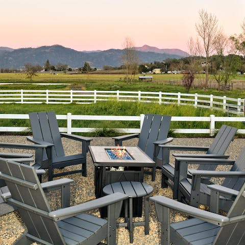 Gather round the fire pit in the evening with drinks and good conversation