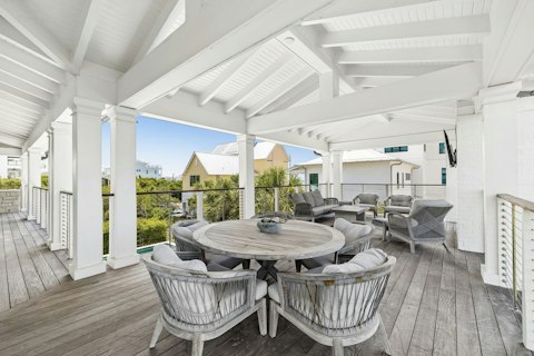 Dine alfresco with lush tropical views beyond