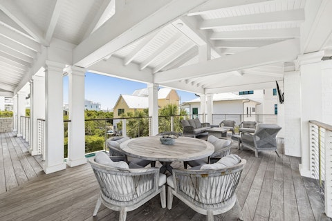 Dine alfresco with lush tropical views beyond