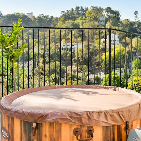 Relax in the hot tub on the communal patio