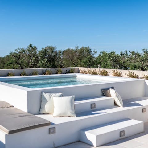 Unwind in the rooftop hot tub with a glass of Prosecco