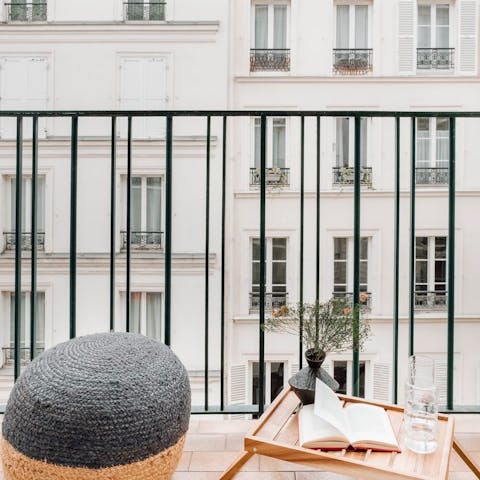 Sip a glass of wine on the balcony before heading out to dinner in a nearby bistro