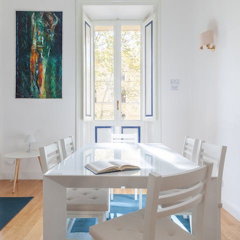 Enjoy a Roman feast in the bright living and dining area