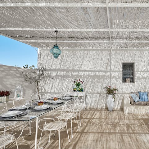 Dine alfresco under the pergola then sip wine on the comfy sofa