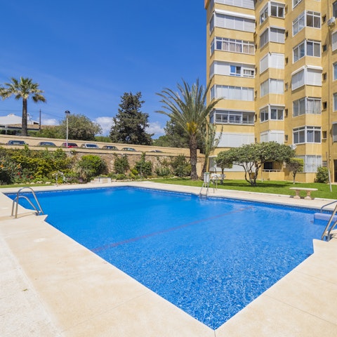 Take a refreshing dip in the communal swimming pool