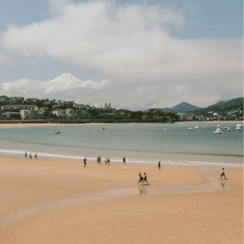 Spend the day on the golden sands of La Concha beach, 50 metres away