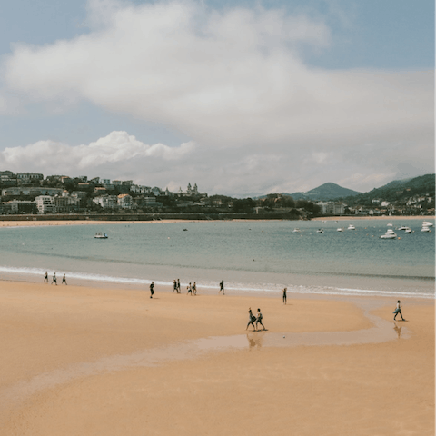 Spend the day on the golden sands of La Concha beach, 50 metres away