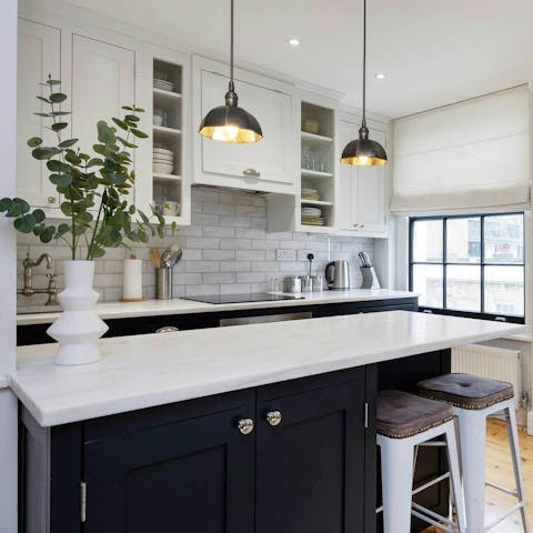 Begin your day with coffee and croissants in the chic kitchen