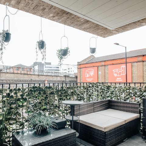 Enjoy sunset drinks on the balcony with the sounds of London below