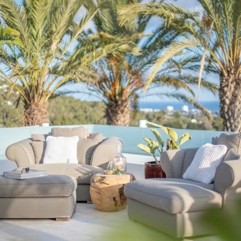 Lounge on the outdoor furniture with a drink in hand