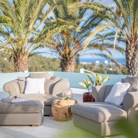 Lounge on the outdoor furniture with a drink in hand