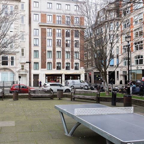 Play table tennis down in the square