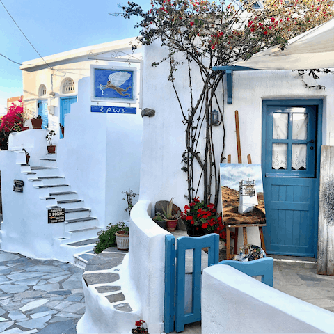 Explore the winding street of Pyrgos village, a seven-minute drive away