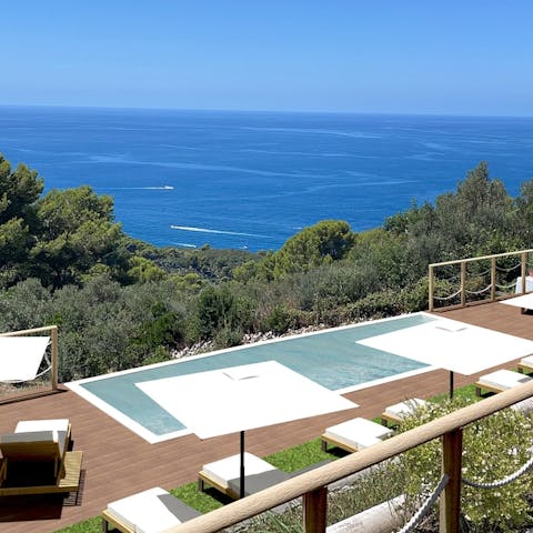 Soak in the sun at the infinity pool with ocean views