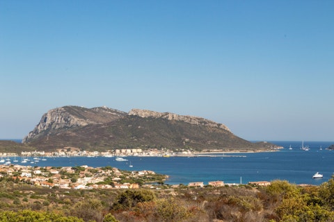 Discover Golfo Aranci's stunning clear waters and golden sandy shores