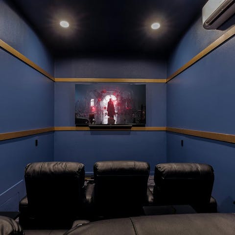 Get comfortable and enjoy some popcorn at the home cinema