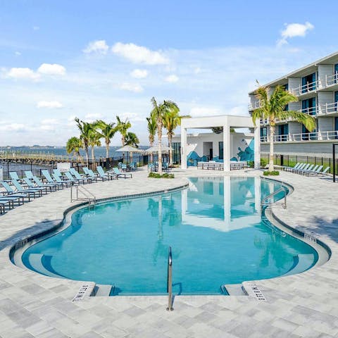 Take a break from your private pool with a day by the resort pool area
