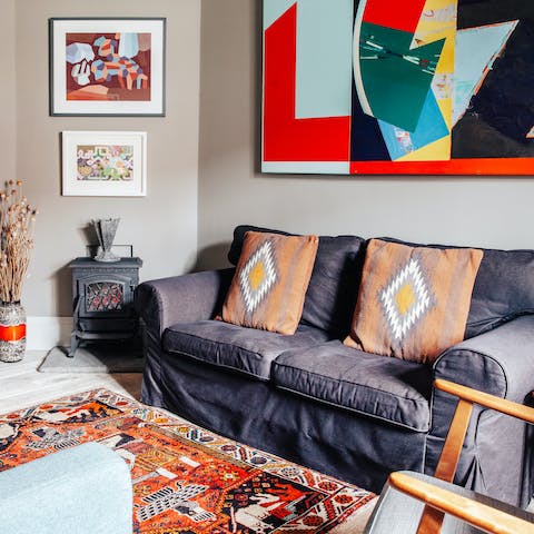 Relax in the bright, cosy lounge with a good film