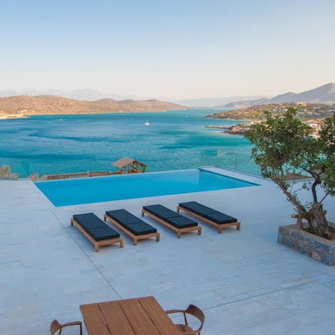 Watch the sunset from the comfort of a lounger with a glass of wine in hand