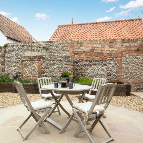 Enjoy a cup of coffee and a biscuit in the pebble garden