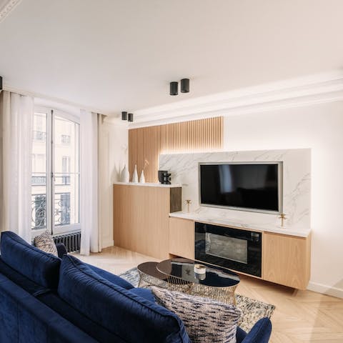 Curl up beside the contemporary fireplace as the lights of Paris begin to twinkle on