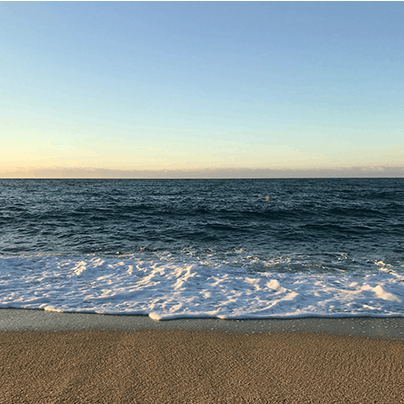 Take a leisurely stroll to the azure waters of Cala Conta beach