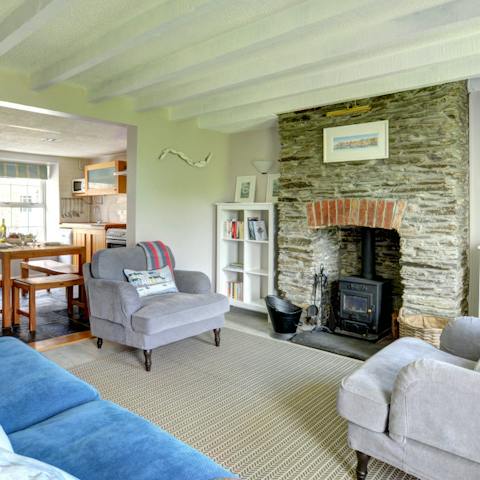 Get cosy in the characterful living room in front of the fire