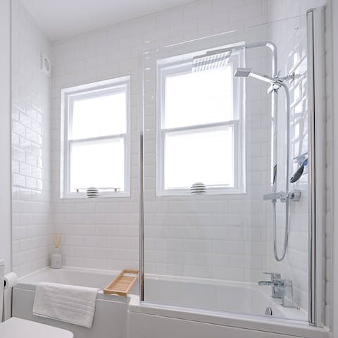 Sink into a well-earned bubbly bath in the L-shaped tub