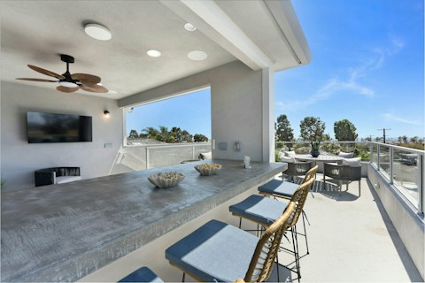 Share alfresco drinks with views towards the ocean