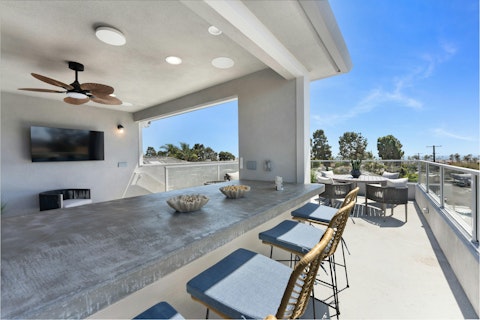 Share alfresco drinks with views towards the ocean