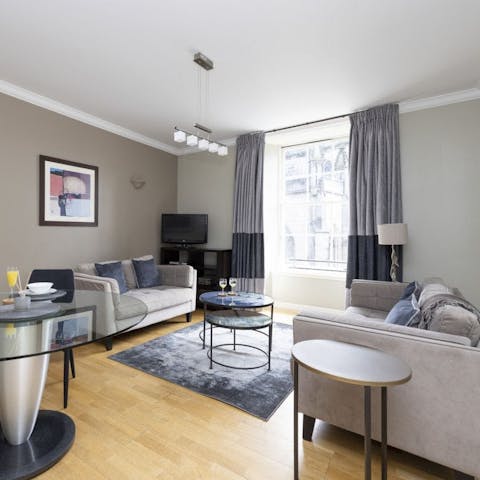 Relax in the airy living space that overlooks St Giles' Cathedral