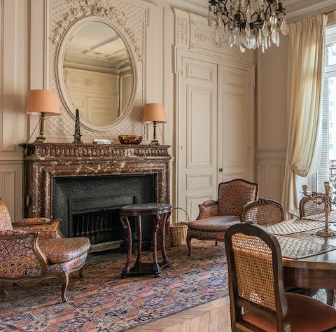 Get warm around the ornate marble fireplace